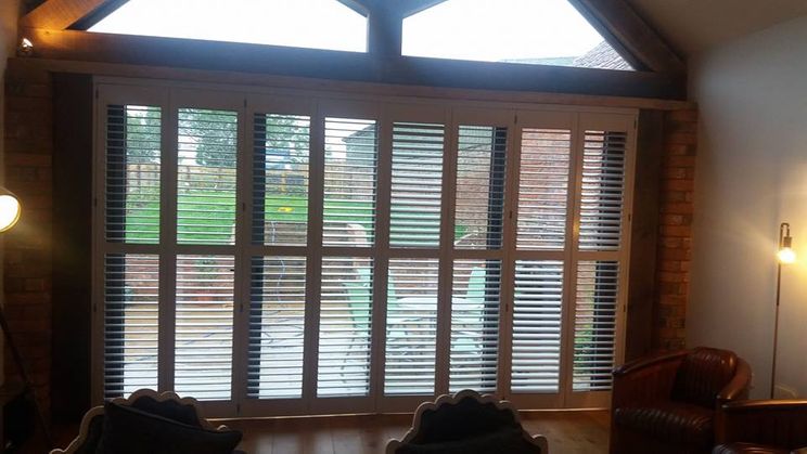 Shutter blinds fitted on a bay window